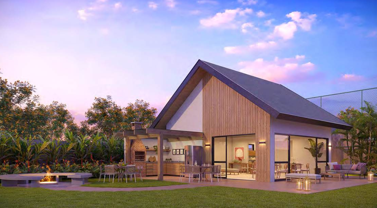 Casa contemporânea com fogueira e varanda ao pôr do sol