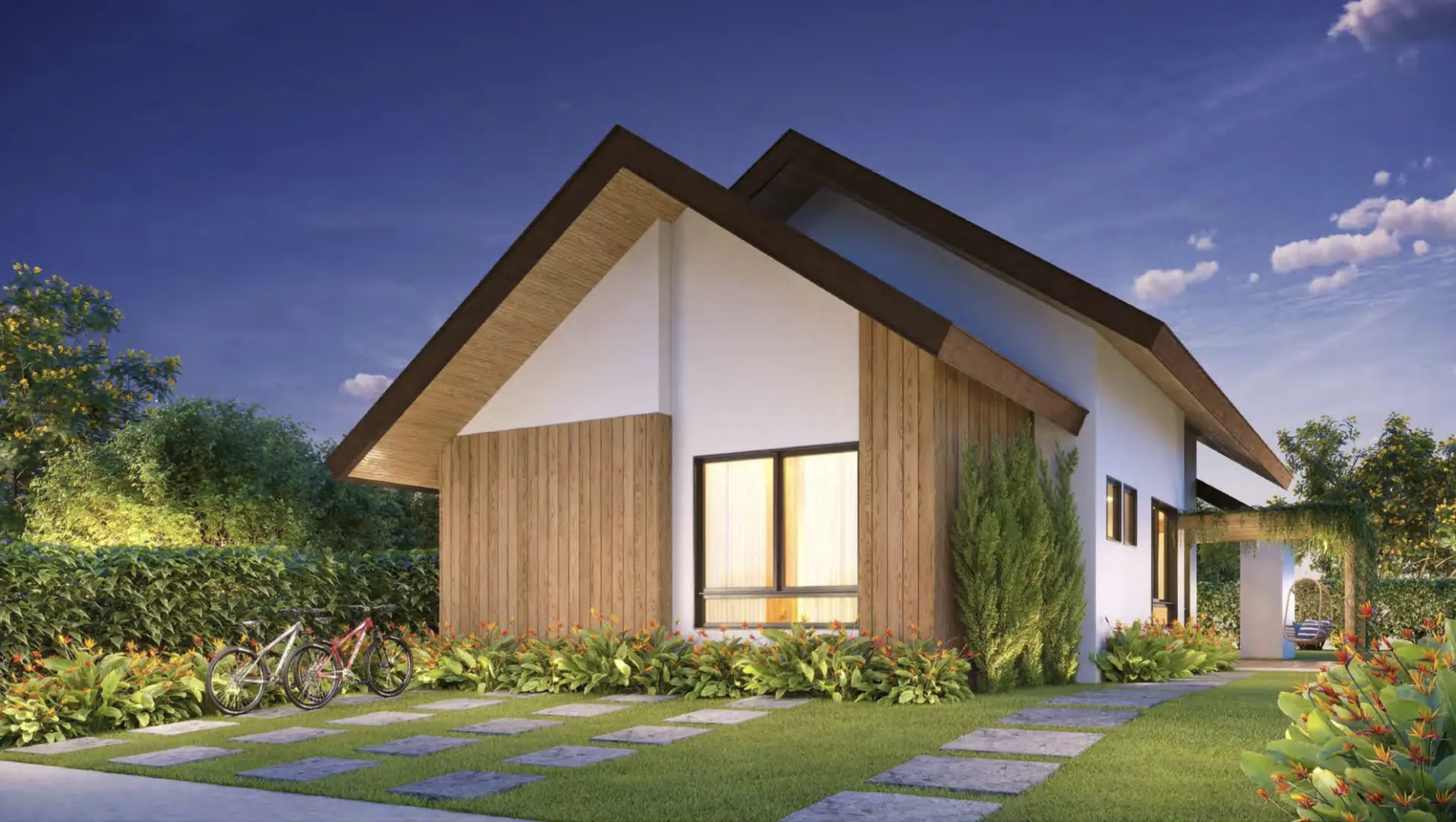 Fachada da casa Viverde ao entardecer com jardim paisagístico